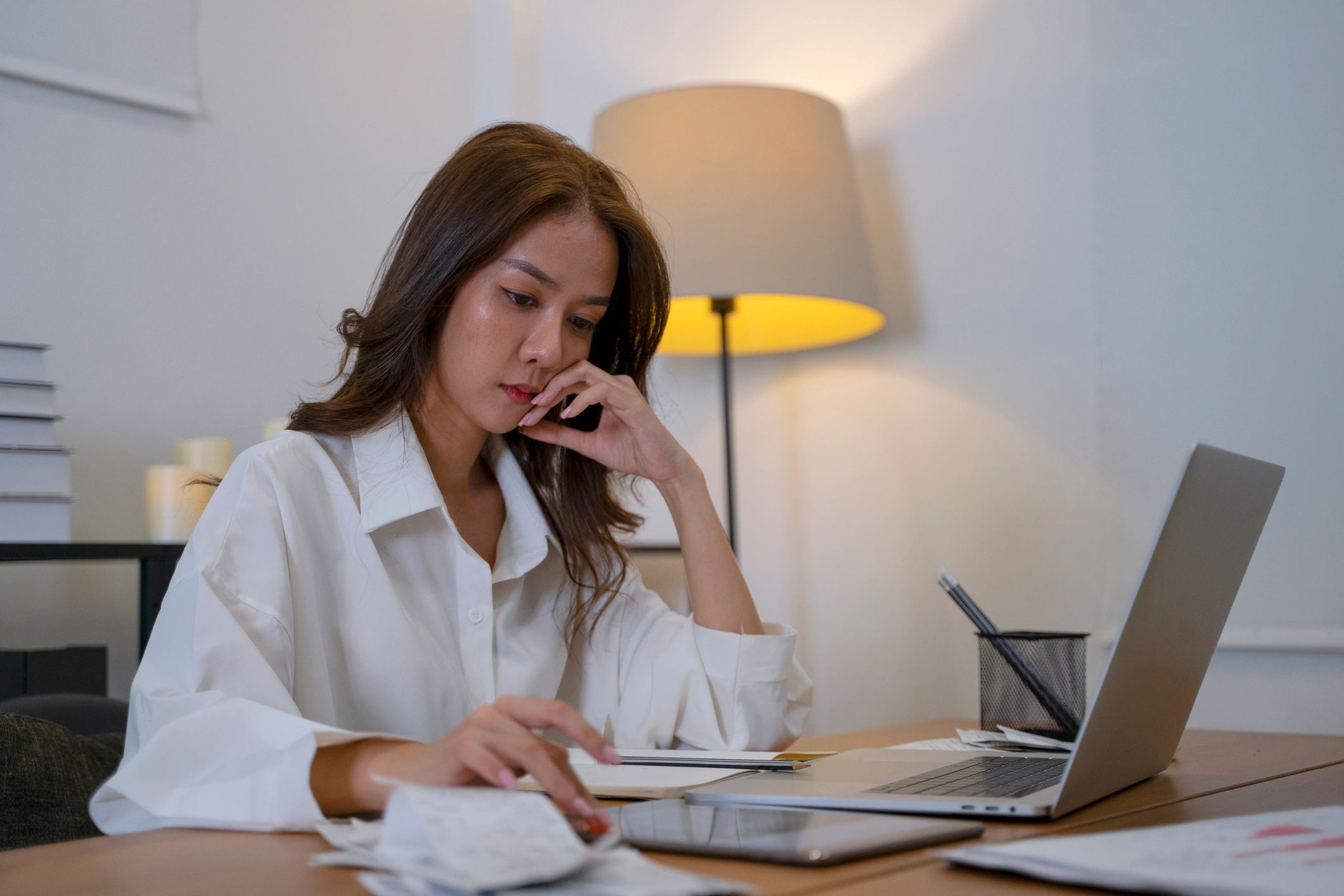 Woman reviewing personal finance options at home