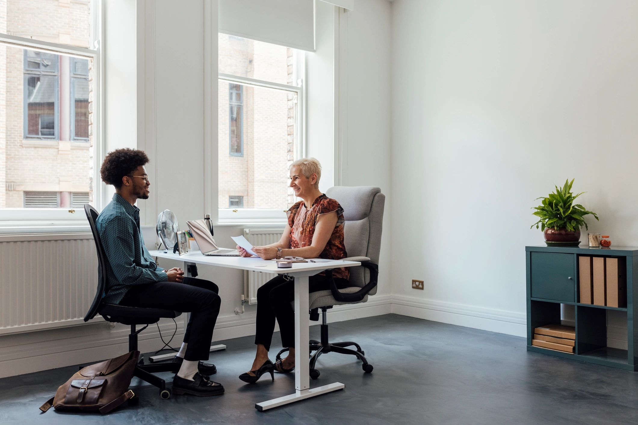 Advisor speaking with a client about loan options