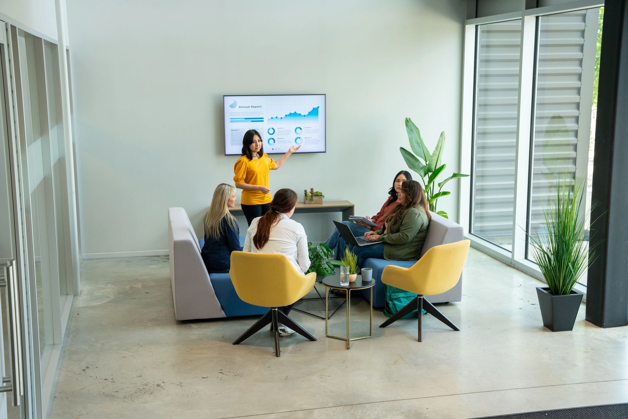 Finance team discussing loan options in a modern office