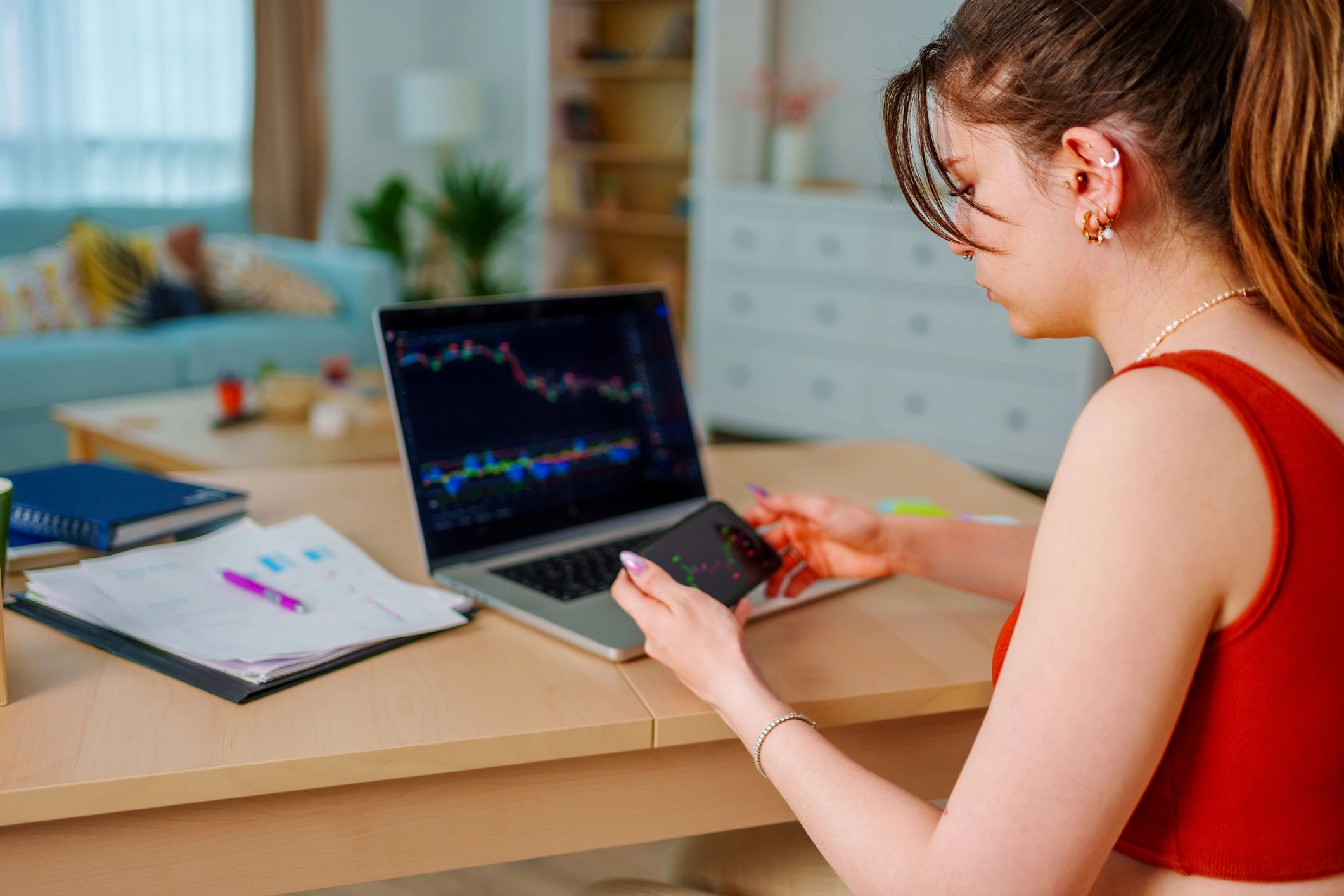 Woman analyzing loan and budget details on a laptop